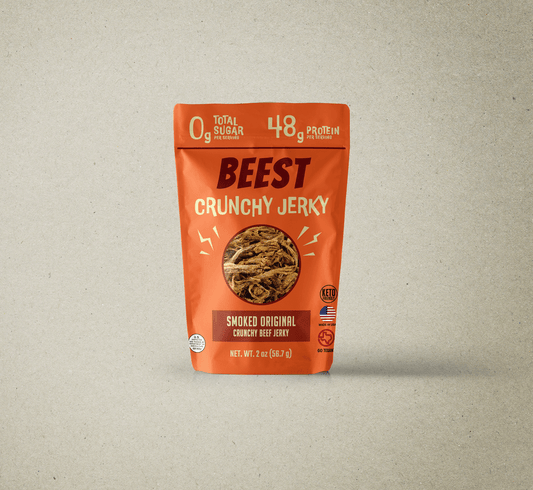 Front of orange BEEST Crunchy Jerky OG Beef bag showing 0 g sugar and 48 g protein